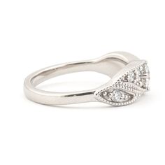 Looking for an elegant diamond ring that will keep up with your active lifestyle? This low-profile modern vintage cocktail-style design combines strength with vintage glamour to give you a ring that is classy as it is durable. Band and Width: A smooth 2-4mm domed profile wide band with milgrain on top element. Metal: Shown in luxe solid platinum with a matte finish. Also available in 14K solid white gold. Stones: Center diamond is a .2ct 3.8mm brilliant-cut round H color, VSI clarity, very good Elegant Marquise Diamond Promise Ring, Timeless Diamond Bypass Ring For Formal Occasions, Classic Design Round Rings For Anniversary, Anniversary Rings With Classic Design, Classic Anniversary Rings, Classic Silver Stackable Rings With Center Stone, Classic 14k White Gold Engraved Promise Ring, Classic White Gold Rings With Classic Design, Classic Engraved Diamond White Promise Ring