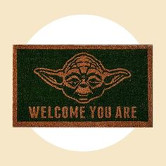 a door mat that says welcome you are with an image of yoda on it