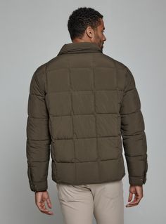 A nylon quilted puffer jacket crafted with recycled fiber insulation fill providing maximum warmth. Features front flap pocket, interior pocket, and hidden phone pocket. Snap closure on cuffs and side vents for comfort. Throw over your favorite flannel for that next-level-cozy feeling. Details Models is 6'1" and wear a size medium. Machine wash cold with similar colors, do not bleach, tumble dry low, do not iron, do not dry clean. 100% Nylon Cold Weather Down Outerwear With Pockets, Outdoor Down Outerwear With Pockets, Khaki Nylon Puffer Outerwear, Brown Down Puffer Jacket With Padded Collar, Functional Quilted Jacket With Padded Collar For Fall, Functional Down Quilted Jacket For Cold Weather, Green Down Outerwear With Padded Collar, Green Down Puffer Jacket With Padded Collar, Utility Nylon Outerwear With Padded Collar