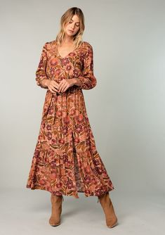 An ultra-flowy long sleeve bohemian maxi dress in a vintage-inspired clay red floral print. Designed in Los Angeles, California. Shop beautiful bohemian dresses here! Brown Long Sleeve Maxi Dress With Boho Print, Long Sleeve Brown Maxi Dress With Boho Print, Brown V-neck Maxi Dress With Floral Print, Brown Floral Print V-neck Maxi Dress, Long Fall Dresses, Long Flowy Skirt, Bohemian Dresses, Voluminous Sleeves, Maxi Dresses Fall