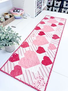 a table runner with hearts on it in a store