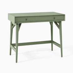 a green desk sitting on top of a white floor next to a wooden table with two drawers