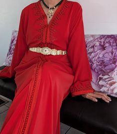 Premium quality handmade silk crepe red Moroccan kaftan. The black belt is included. Important Note: Stainless steel gold belts are not included. Please contact us for more information. This caftan is ideal for family occasions such as family celebrations, the month of Ramadan, Eid, or weddings. Several sizes available. It is also possible to personalize your caftan according to your taste, contact us for more information. Top quality kaftan, handy made. The black belt is included This caftan is ideal for family occasions such as family celebrations, the month of Ramadan, aid, or weddings. Several sizes available, it is possible to have it in Matchi-Matchi version: mom/daughter. It is also possible to customize your caftan according to your taste, contact us for more information Elegant Red Kaftan With Traditional Drape, Red Traditional Drape Kaftan For Party, Elegant Red V-neck Kaftan, Elegant Formal Kaftan With Traditional Drape, Elegant Abaya For Traditional Ceremonies, Luxury Wedding Abaya, Elegant Red Long Sleeve Abaya, Elegant Long Sleeve Red Abaya, Elegant Gold Kaftan For Traditional Ceremonies