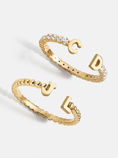 Our 18K Gold Double Initial Custom Ring is an updated take on a classic initial accessory. Available in an all-gold and a subtle sparkly version, these rings are ones you'll have for years to come. Add your own initials or that of you and a loved one to create a keepsake you'll cherish. Not to mention, this ring is crafted with 18K gold plated sterling silver and Cubic Zirconia stones. Cheap Customizable Rings For Women, Trendy Accessories Rings, Cute Set Of Rings, Rings And Jewlery, Tectangle Ring, Cheap Customizable Women's Rings, Dinosuar Rings, Cheap Casual Rings For Women, Cheap Chic Women's Rings