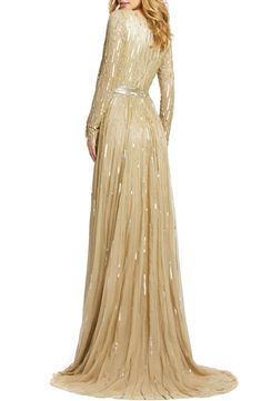 Look like you just stepped off the red carpet in this plunging V-neck gown illuminated with stripes of glittering sequins and light-catching beads. Style Name:Mac Duggal Long Sleeve Sequin & Bead Stripe Gown. Style Number: 5903330_1. Luxury Sequined V-neck Gown, Luxury V-neck Gown With Sequins, Luxury V-neck Sequined Gown, Red Carpet Embellished Floor-length Gown, Floor-length Embellished Gown For Red Carpet, Glamorous Embellished Gown For Red Carpet, Formal Cocktail Attire, Macys Women, Mesh Gown