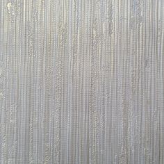 an abstract textured wallpaper pattern with white and gray stripes on the outside side