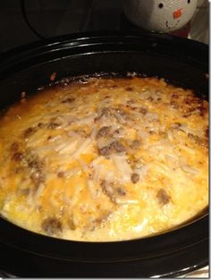 a casserole dish in a crock pot on the stove