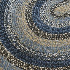 a blue and yellow area rug with an interlocked design