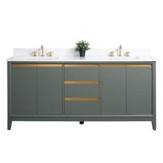 two sinks on top of a gray cabinet with gold trimmings and white counter tops