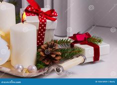 christmas decorations with candles and presents on the table stock photo - image 349784