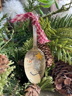 a spoon is hanging from a christmas wreath