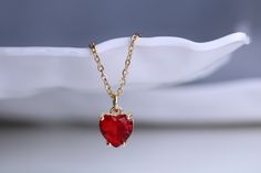 Gold filled red ruby heart stud charm pendant necklace with matching earring option Dainty minimalistic red heart tiny charm necklace High quality 18k gold plated  With adjustable chain - Length option of 14'' to 16'' ,or 16'' to 18''  chain. Dainty minimalistic pendant charm. Great as a gift ,or for yourself for that special occasion! Any questions feel free to ask! Thanks for supporting a small family run business! Comes packaged in a beautiful box ready to gift! Red Heart Choker, Minimalistic Pendant, Heart Necklace Red, Ruby Heart Necklace, Heart Necklace Gold, Tiny Heart Necklace, Red Heart Necklace, Ruby Heart, Tiny Charm