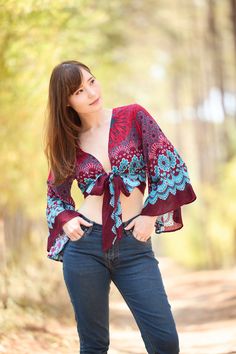 Embrace bohemian sophistication with our adaptable women's wrap top. Featuring a chic and graceful design, this handmade rayon boho top offers endless styling possibilities. Whether you prefer tying it in the front or back, wrapping it around, or innovating your own signature style, this top is destined to be a go-to in your wardrobe during summer and hot weather. This alluring top effortlessly complements various bottoms, from jeans and denim shorts to mini skirts, and exquisitely enhances the charm of romantic maxi skirts. Elevate your ensemble with this essential piece that effortlessly transitions from casual to chic for any occasion. Lannaclothesdesign products are uniquely designed and latest fashion trends. You can choose from many different colors and sizes. We use high quality pro Womens Boho Tops, Boho Long Sleeve Top, Bohemian Wrap, Hippie Clothes, Trendy Top, Boho Shirts, Figure Poses, Valentine's Day Outfit, Boho Top