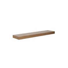 a wooden shelf sitting on top of a white wall