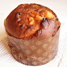 a muffin sitting on top of a white table