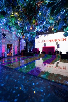 a large room with lights and decorations on the ceiling