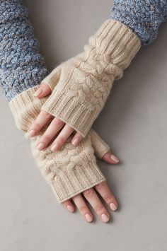 Cable-knit motifs were first inspired by nautical ropes and donned by fisherman years ago. Here, the age-old design lends its traditional past to a pair of contemporary fingerless gloves. This lovely winter essential has the ability to keep the cold at bay while letting you move your hands freely. Slide these wrist warmers on over your favorite sweater or layer over a contrasting pair of gloves. Cashmere Sweater Mittens, Glove Pattern, Fur Gloves, Knitted Mittens, Gloves Design, Cashmere Gloves, Crochet Fingerless Gloves, Crochet Mittens, Fingerless Gloves Knitted