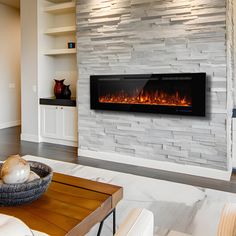 a living room with a fire place in the center