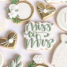 decorated cookies with the words miss and mrs written on them are arranged next to each other