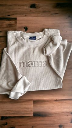 Time to get comfy! This embroidered sweatshirt will be your new favorite with the embroidered mama font in a warm neutral to match the sweatshirt.  -Sizes available: Adult Small - Adult 2XL  -Fit: oversized -Material: 100% cotton, corded fabric  -Machine embroidered  -design centered on chest Long Sleeve Tops With Embroidered Logo For Loungewear, Long Sleeve Top With Letter Embroidery For Loungewear, Long Sleeve Top With Embroidered Text For Loungewear, Relaxed Fit Top With Embroidered Logo, White Custom Embroidered Tops For Loungewear, Relaxed Fit Top With Embroidered Logo For Loungewear, Cotton Tops With Letter Embroidery For Loungewear, Fall Sweater With Embroidered Logo For Loungewear, Custom Embroidery Loungewear Tops