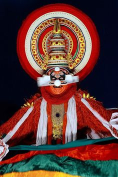 an elaborately decorated mask and headdress on display