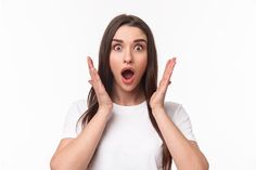 a woman making a surprised face with her hands