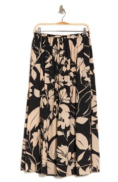 A flowy pull-on skirt cut in an A-line silhouette offers whimsical style and instant versatility. Elastic waist 100% polyester Machine wash, tumble dry Imported Spring A-line Bottoms With Elastic Waistband, Floral Print Flowy Skirt, Flowy Floral Print Skirted Bottoms, Spring A-line Maxi Skirt With Elastic Waistband, Casual A-line Maxi Skirt With Elastic Waistband, Spring Vacation A-line Skirt, Casual Stretch Floral Print Maxi Skirt, A-line Floral Print Relaxed Skirt, A-line Floral Print Skirt