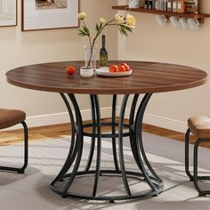 a dining table with two chairs around it