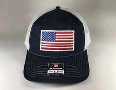 the washington trucker hat has an american flag patch on it