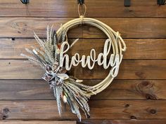 a wreath with the word hodgy hanging on it