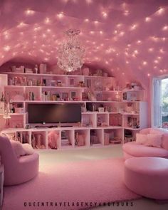 a living room with pink furniture and lights on the ceiling