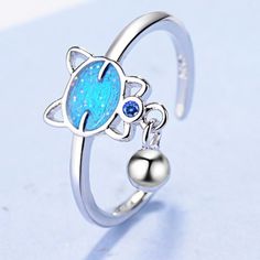 "925 Sterling Silver Blue Kitten Bell Crystal Zircon Ring For Woman, K203 "" Available Size: Adjustable (5.5 To 7.5) Metal: 925 Sterling Silver Stone: Cubic Zirconia 100 % Lead And Nickel Free 100 % Hypoallergenic Will Not Tarnish Or Fade Perfect For Gift, Holiday, Christmas, Birthday, Vacation, Mother's Day, Valentine's Day, Wedding, Engagement , Bridal, Promise, Anniversary, Party Item Code: R018 Thank You For Shopping With Us!""" Blue Sterling Silver Ring, Blue Sterling Silver Fine Jewelry Ring, Light Blue Sterling Silver Rings As Gifts, Light Blue Sterling Silver Fine Jewelry Ring, Blue Sterling Silver Open Ring Jewelry, Blue Sterling Silver Open Ring, Blue Topaz Open Ring Jewelry, Light Blue Sterling Silver Ring Gift, Blue Cubic Zirconia Open Ring Jewelry