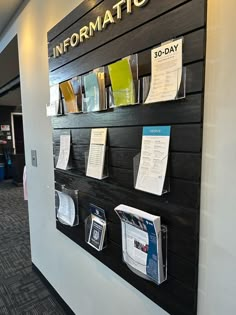 the information board is covered with papers and folders on it's side wall