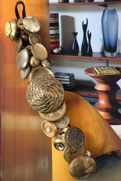 a bunch of buttons that are on the side of a couch in a room with bookshelves