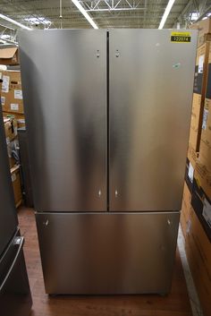 a large stainless steel refrigerator in a kitchen