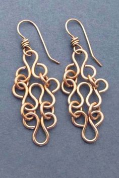 Inspired by ancient lace and filigree designs, these romantic dangle earrings are handmade entirely in solid bronze. I loop and curl the bronze into a very feminine and ethereal pattern. The pale rose gold / champagne blush color of the bronze is right-on-trend and so flattering to every skin tone. Elegant Rose Gold Copper Wire Jewelry, Elegant Bronze Copper Jewelry, Elegant Copper Earrings For Wedding, Elegant Rose Gold Earrings With Copper Wire, Elegant Bronze Wire Wrapped Jewelry, Elegant Bronze Copper Earrings, Elegant Hand Forged Chandelier Earrings As Gift, Elegant Copper Wire Drop Earrings, Elegant Handmade Brass Chandelier Earrings