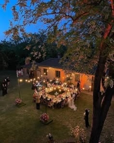 an aerial view of a wedding reception in the evening