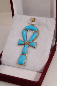 "Egyptian Handmade Ankh Cross Key of Life Turquoise 18K Yellow Gold Pendant 6.5 Gr Weight Approximate : 6.5 Gr Height : 2.2\" = 56 mm Width : 0.9\" = 23 mm ✔ IT IS Tested & SIGNED WITH THE EGYPTIAN Gold Government HALLMARK FOR 18K GOLD to Ensure Authenticity. ✔ Lovely gift idea ABSOLUTELY GORGEOUS, LOOKS FABULOUS ON. ✔ 100% Egyptian handmade. ✔ Condition: A brand-new, exactly as on the photos. ★ GIFTS ✔ All items are packaged in a paper jewelry gift box, ready for gifting. ✔ If you are sendi Key Of Life Egyptian, Egyptian Painting, Egyptian Gold, Egyptian Revival Jewelry, Egypt Jewelry, Ankh Cross, Key Of Life, Gold Key, Egyptian Revival