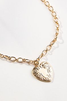 This necklace features a heart-shaped pendant and a chain. It is available in two finishes: 14k gold-plated brass and rhodium-plated brass. The necklace closes with a lobster clasp. Heart Pendant Necklace Gold, Gold Heart Pendant, Heart Pendant Gold, Gold Plated Necklace, Gold Heart, Heart Jewelry, Heart Pendant Necklace, Heart Of Gold, Jewelry For Women