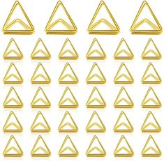 a set of gold triangle shapes on a white background