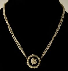 "Rare 3-strand seed pearl necklace C. 1800 - 1830's. The main attraction of the necklace is front push-in clasp. It is made of seed pearl wreath wrapped around polished black onyx dome with seed pearl bouquet in the center. The back and the clasp's tongue are made of 14K gold (tested). The necklace is made of 3 strands of glittering seed pearls. It is 17\" around neck. The clasp is approx. 1\" diameter. The necklace weighs 11.7 grams. Very good antique condition." Victorian Pendant Jewelry For Opera, Victorian Jewelry With Pearl Pendant, Victorian Pearl Pendant Jewelry, Victorian Style Round Pearl Pendant Jewelry, Victorian Style Round Pearl Pendant, Antique Round Pearl Jewelry, Antique Round Necklace With Rose Cut Diamonds, Victorian Style Pearl Chain Jewelry, Vintage Pearl Pendant Jewelry With Round Beads