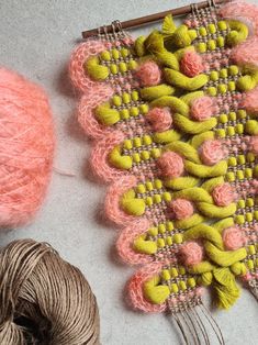 two skeins of yarn sitting next to each other on top of a table