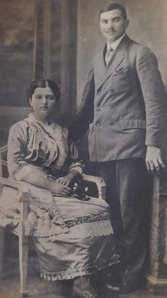 an old black and white photo of two people