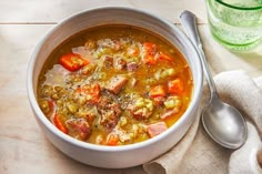 a bowl of soup with meat and vegetables