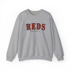 Reds fans! Cheer on your favorite team in style with this comfortable and stylish crew neck sweatshirt. Made from high-quality materials, polyester and cotton, this sweatshirt is perfect for showing support to your team in the stands or from the comfort of your own home. The collar is ribbed knit, so it retains its shape even after washing. There are no itchy side seams on these sweaters. - 50% cotton, 50% polyester - Medium-heavy fabric (8.0 oz/yd² (271.25 g/m - Loose fit - Sewn-in label - Runs true to size **Love our crew neck sweatshirt but want it in a different color? Contact us and let us know! We offer a range of color options and we'd be happy to work with you to create the perfect sweatshirt. Just send us a message with your preferred sweatshirt/font color and we'll do our best to Baseball Sweater, Baseball Sweatshirts, Red Crewneck, Reds Baseball, Gameday Outfit, Sew-in Labels, Own Home, Football Shirts, Favorite Team