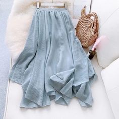 Elegant Solid Color Pleated Midi Skirt – lastrafashion Light Blue Flowy Midi Skirt, Blue Midi Length Lined Pleated Skirt, Light Blue Pleated Flowy Skirt, Flowy Midi-length Pleated Skirt With Lining, Blue Flowy Midi-length Pleated Skirt, Cotton Linen Dresses, Hooded Parka, Vintage Swimwear, Elegant Skirt