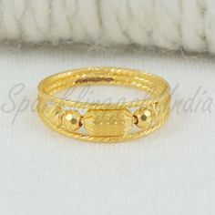 Inspired by the timeless beauty of traditional Indian artistry, this 22k gold ring embodies grace and sophistication. Handcrafted with intricate detailing, the design showcases a blend of classic motifs and contemporary flair. Perfect for marking special occasions or adding a touch of luxury to your everyday look, this ring celebrates the richness of Indian heritage with every gleaming curve. 22k gold ring handmade jewelry made in India Metal is Real Gold Not Filled or Not Gold Plated Metal - Ye 22k Gold Ring, Beads Ring, Indian Heritage, Beaded Rings, Gift Jewelry, Traditional Indian, 22k Gold, Showcase Design, Ring Handmade