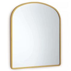 a gold framed mirror on a white wall with an arch shaped mirror in the middle