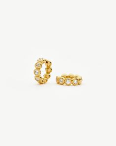 Tennis Small Hoop Earrings| 18k Gold Vermeil Cubic Zirconia 18k Gold Vermeil/Cubic Zirconia. These Classic Small Gold Hoops Feature Beaded Detailing, Embellished with Cubic Zirconia. Wear Solo or Team with Studs or a Hoops for an Instant Ear Stack. Metal: 18K Recycled Gold Vermeil on Recycled Sterling Silver Gemstone: Cubic Zirconia Outer Diameter: 13. 8mm Hoop Width: 3. 9mm Hoop Thickness: 3mm Weight: 4. 5g Product Code: Gu-G-E19-Ns Small Gold Hoop Earrings, Small Gold Hoops, Sterling Silver Anklet, Ear Stack, Small Hoop Earrings, Cubic Zirconia Earrings, Silver Anklets, Birthstone Bracelets, Zirconia Earrings