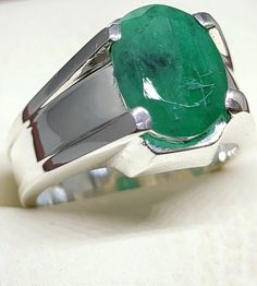 Natural Emerald Ring-Birthstone Ring For Women- 4.50 Ct. Emerald Rashi Ratan Astrological Stone For Unisex-Anniversary Gift Her Stone -- Natural Emerald  Weight--- 4.50 Carat Stone Band Colour--- Silver Metal --- 925 Sterling Silver Certified Stone To eliminate the wrath of Rahu Green Round Signet Ring With Prong Setting, Silver Gia Certified Round Emerald Ring, Emerald Signet Ring With Prong Setting, Oval Green Signet Ring With Prong Setting, Anniversary Untreated Sapphire Ring, Green Oval Signet Ring With Prong Setting, Untreated Oval Ring For Anniversary, Concave Gemstone Ring For Anniversary, Anniversary Gemstone Ring With Concave Shape